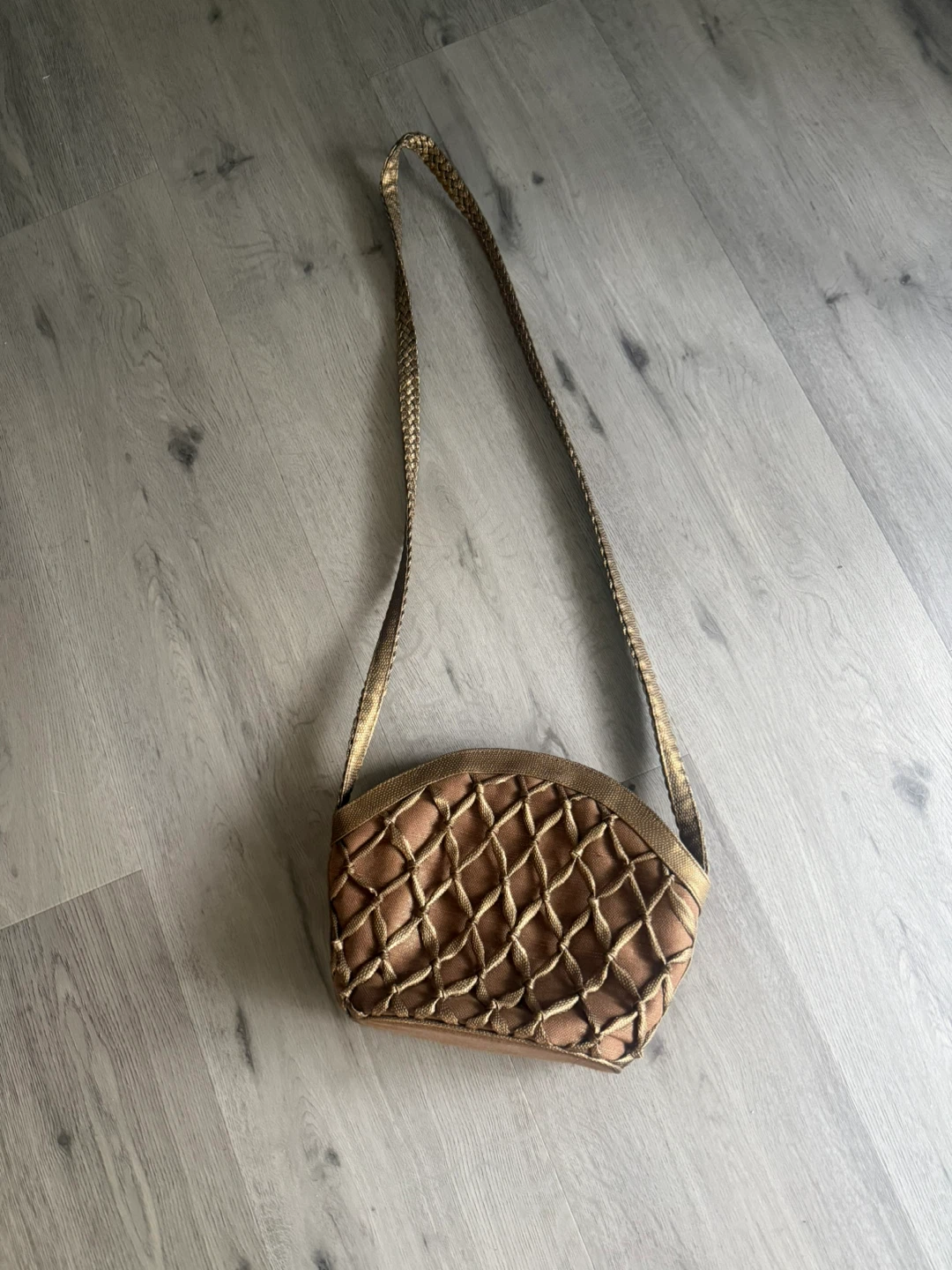 Brown woven crossbody bag with gold trim