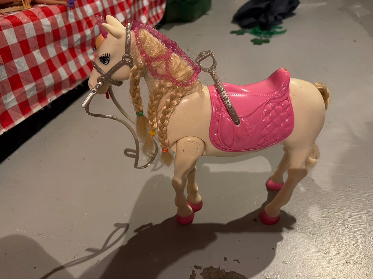 Barbie horse lights up and moves