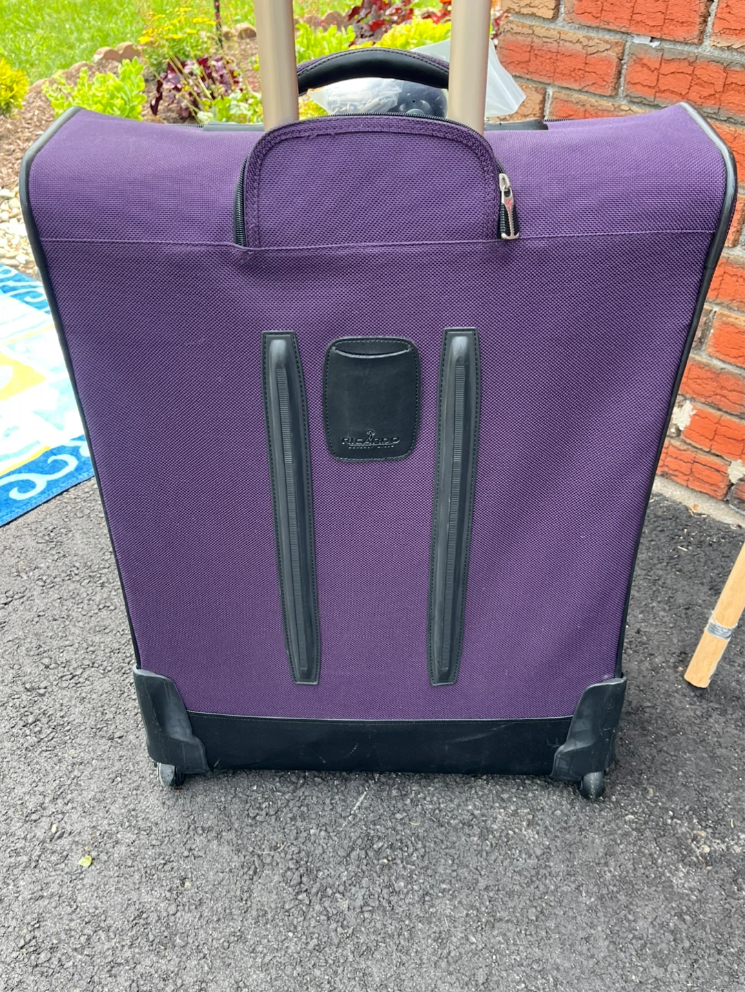 Purple Ricardo Luggage with Replacement Wheel