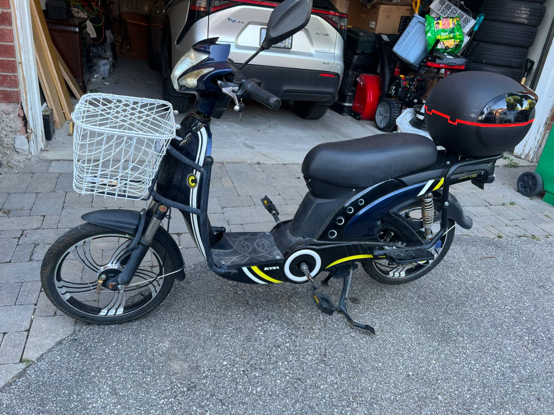 Blue Electric Scooter with Basket and Storage Box