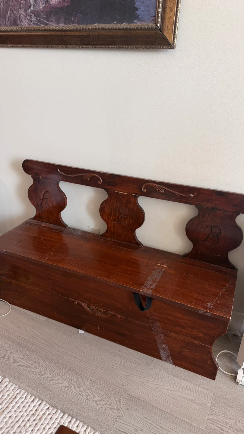 Wooden storage bench with ornate detailing