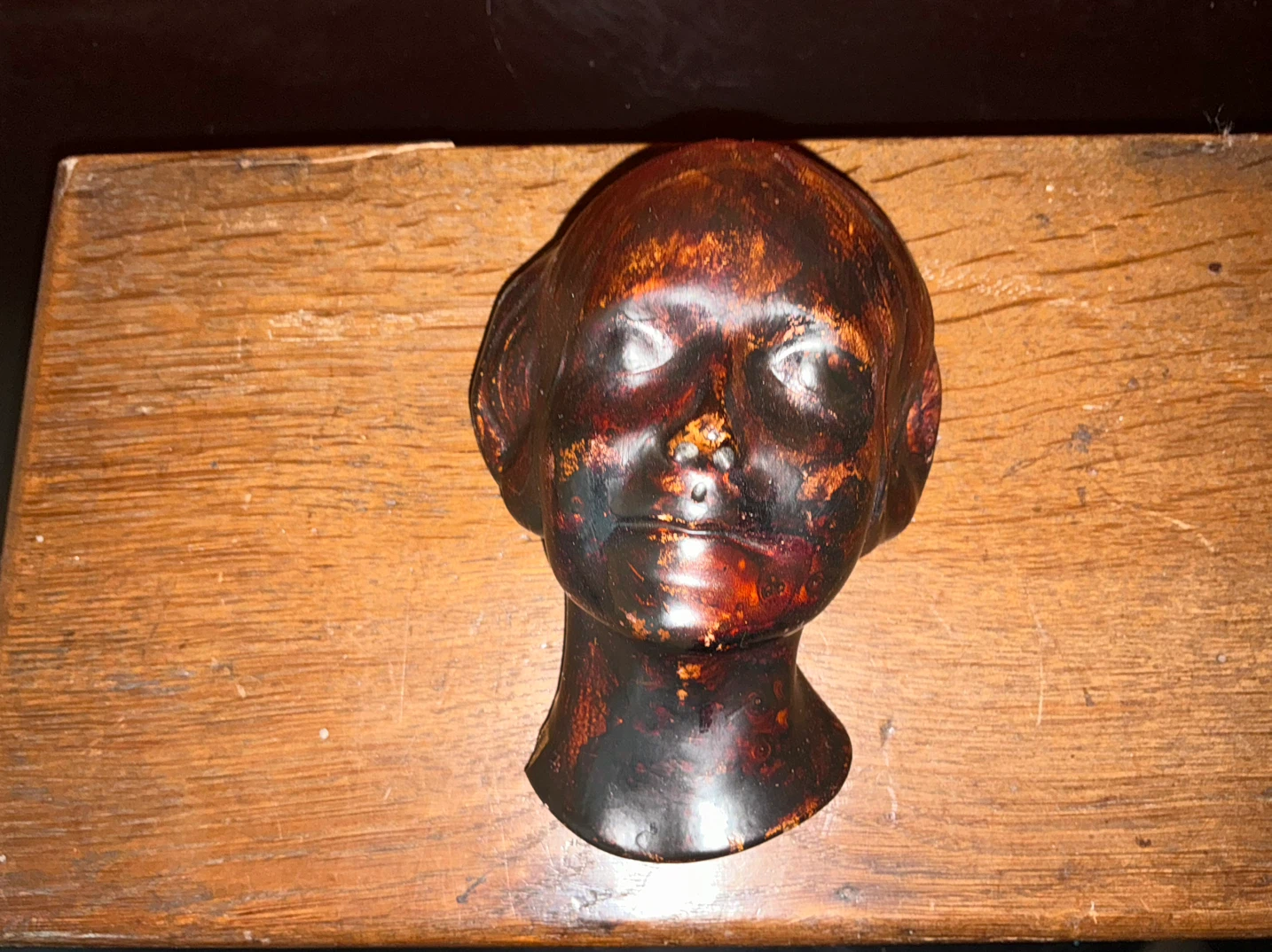 Vintage chalkware sculpture with dark patinated finish