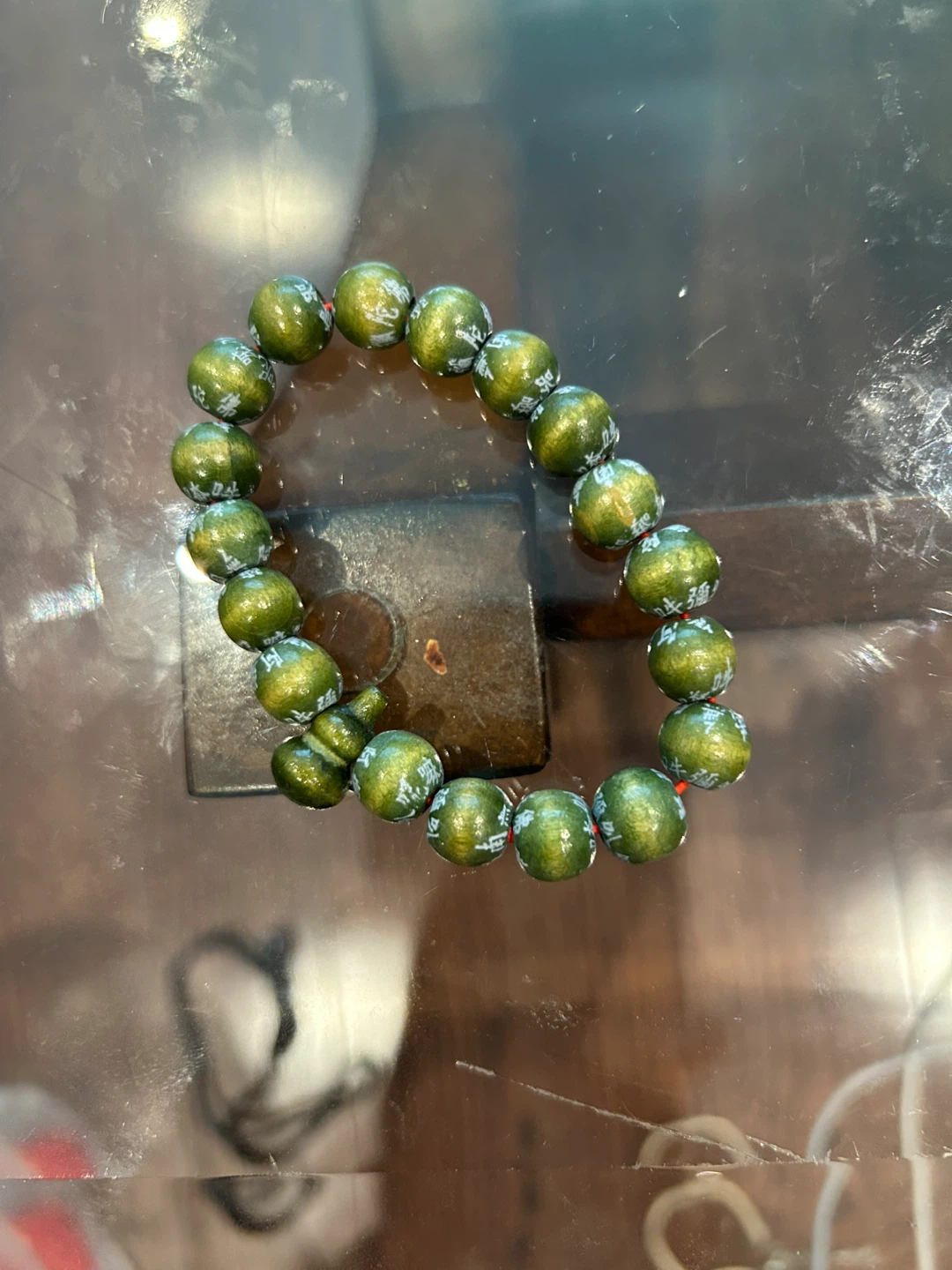 Green Beaded Bracelet with White Script