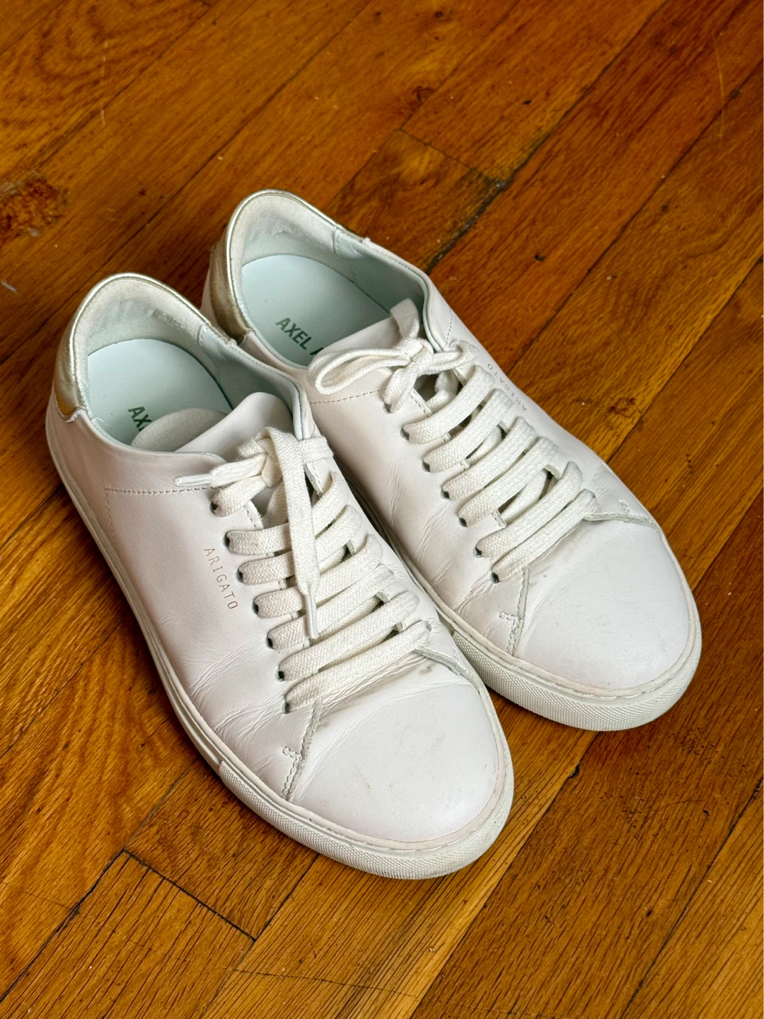 White Axel Arigato Sneakers with Gold Detail