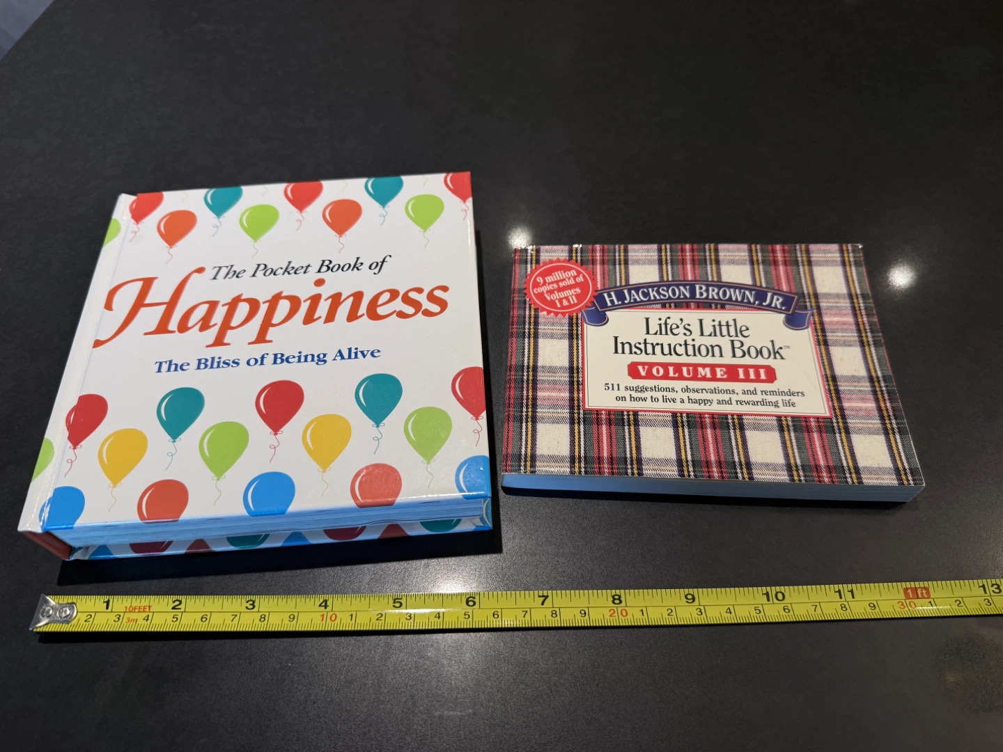2x books about happiness