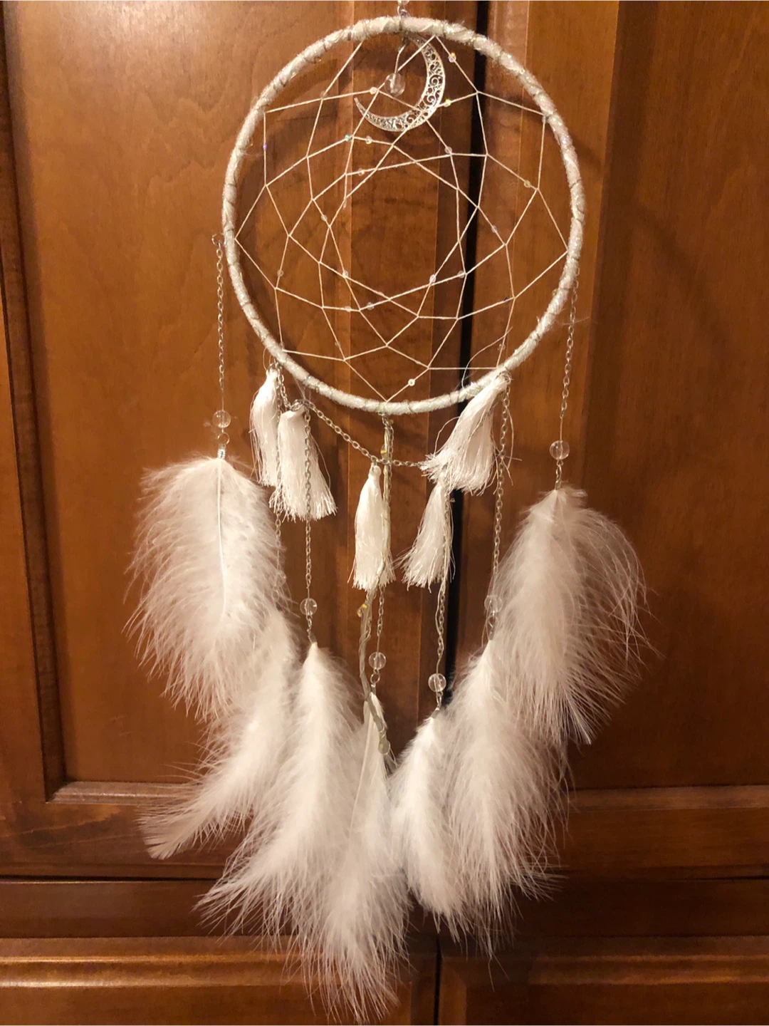 White dreamcatcher with white feathers