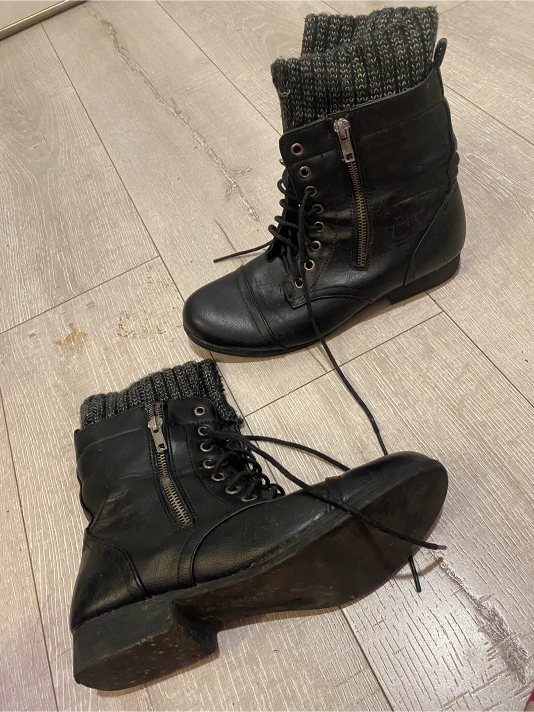Black combat boots with knit cuffs