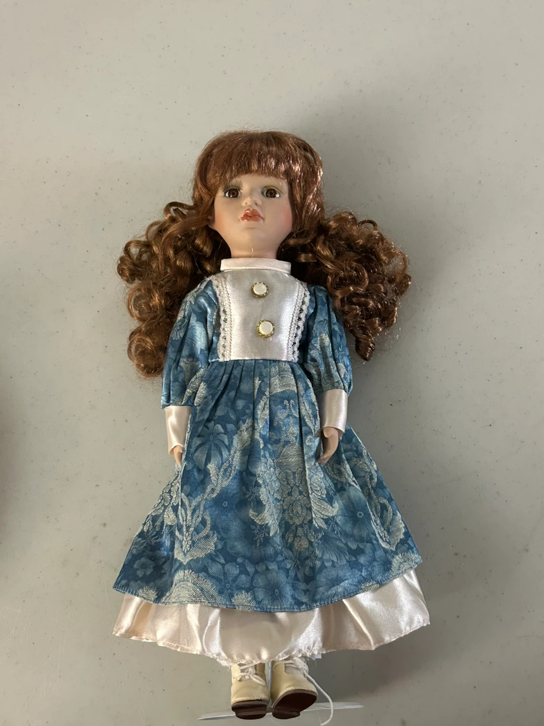 Collector’s  Porcelain Doll with Blue & Cream Dress with Stand