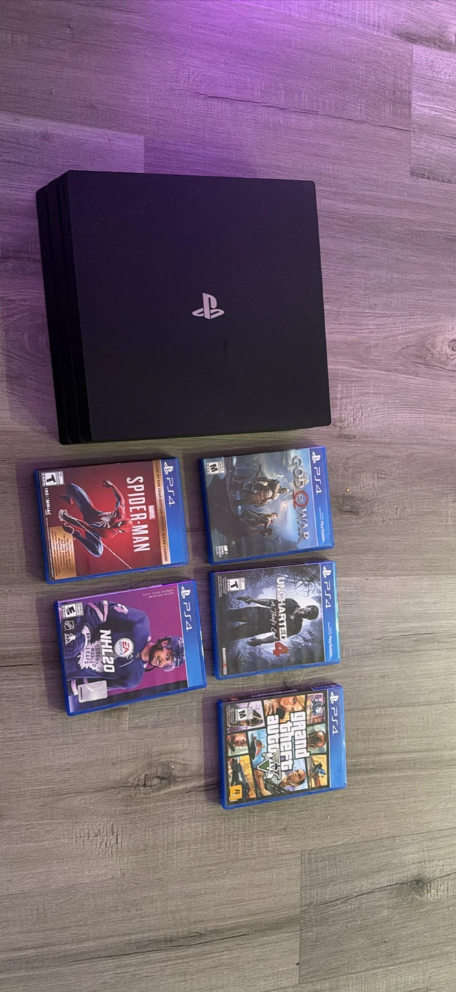 Sony PlayStation 4 Pro Console with Games and Controller