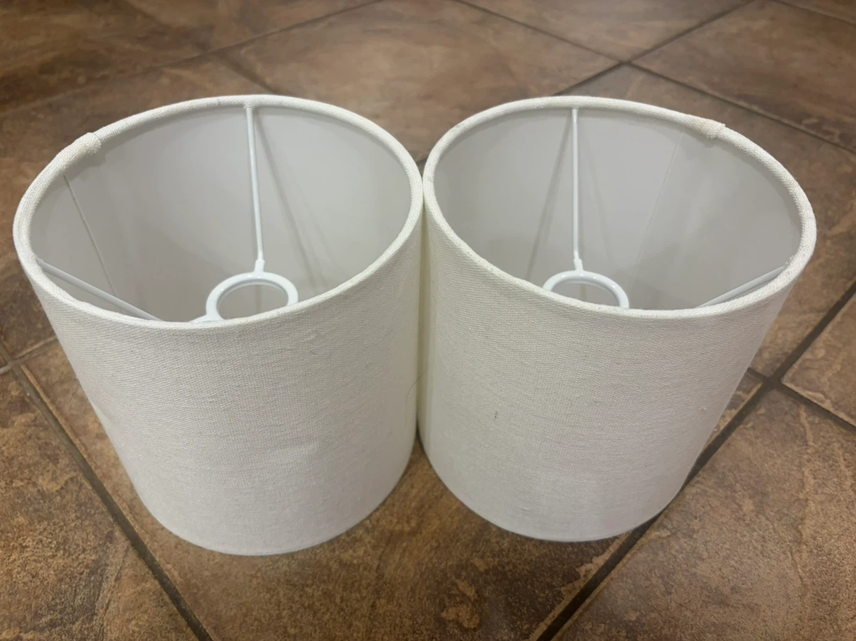 Two white drum lampshades