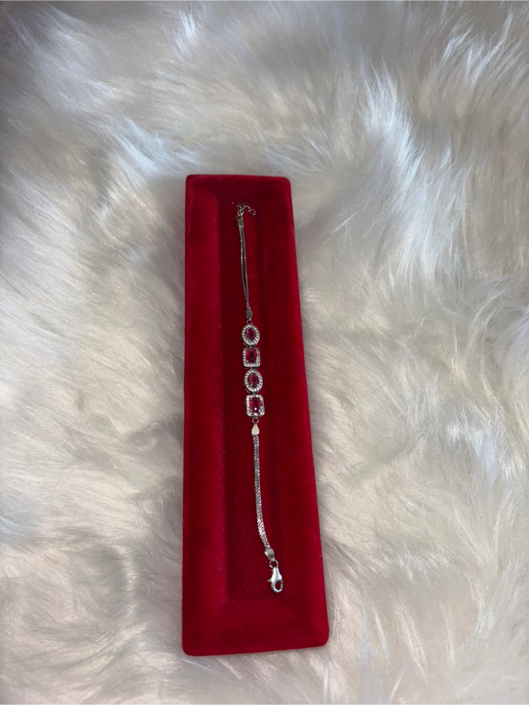 Silver bracelet with red stones