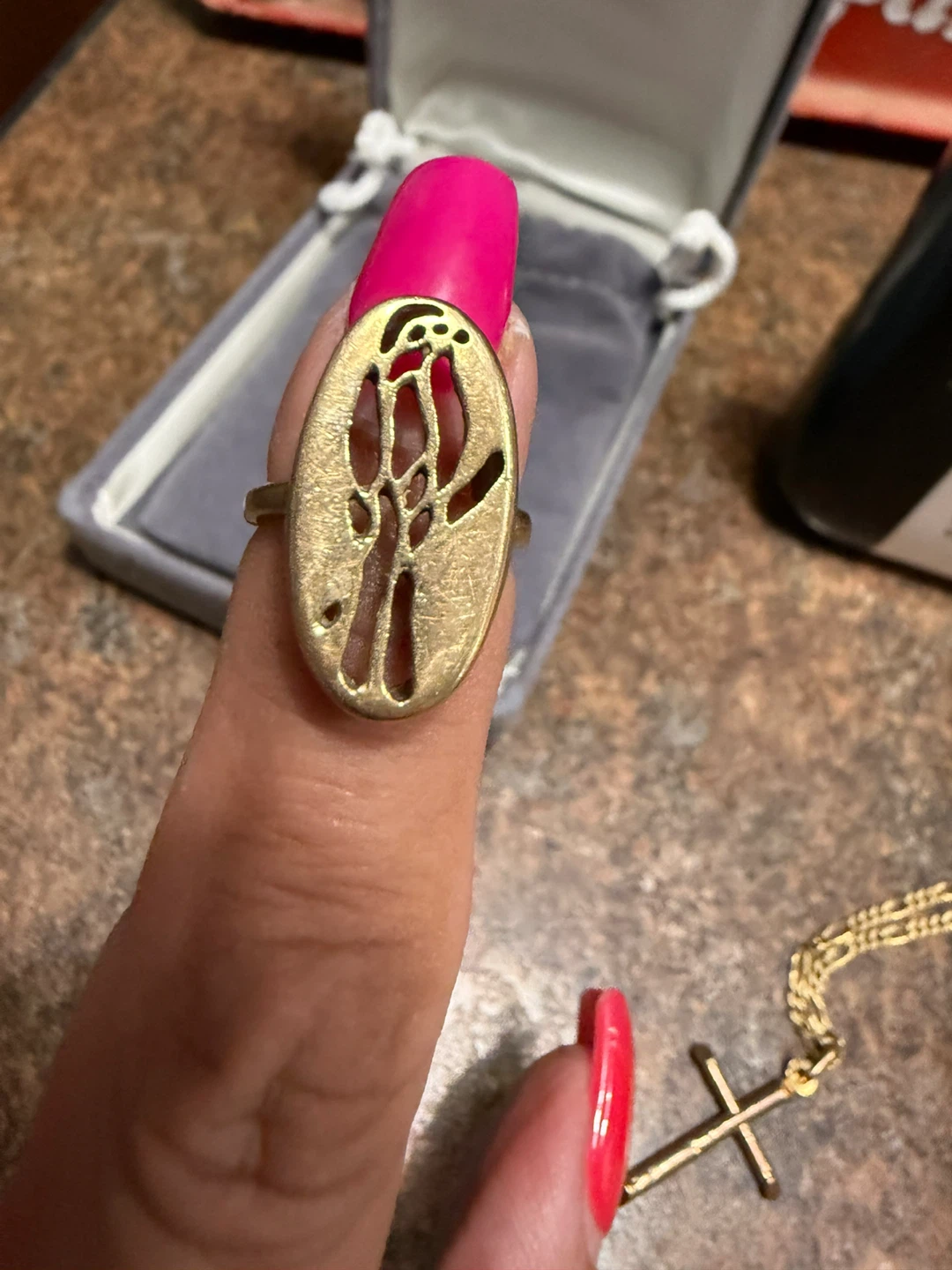 Gold  oval ring with parrot design