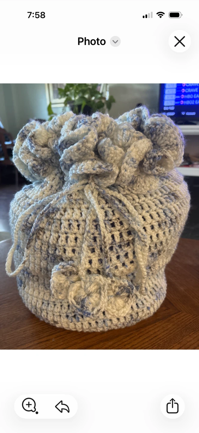 Hand-crocheted Drawstring Bag with Floral Accents