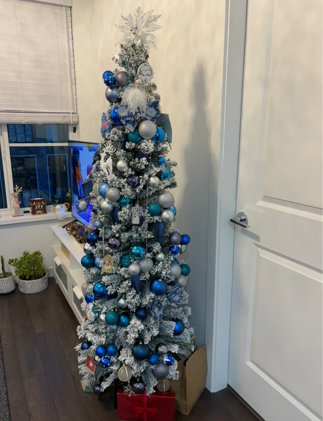 Flocked Christmas Tree with Blue and Silver Ornaments