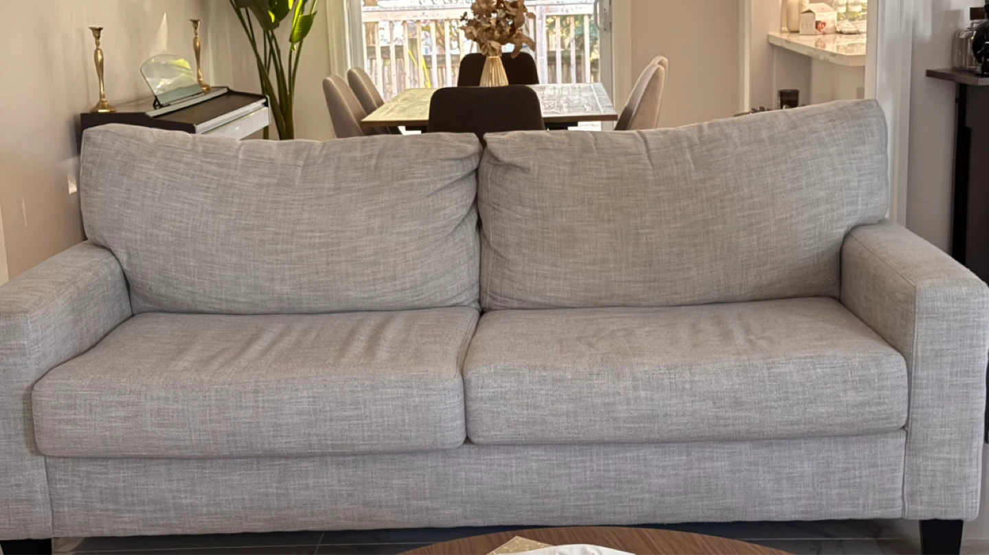 Grey couch from the brick