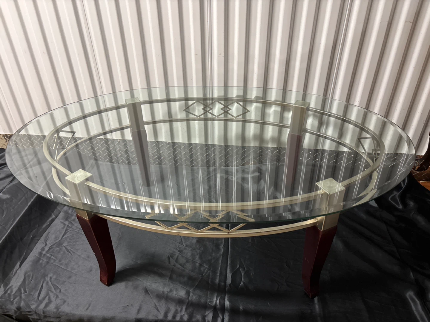 Oval Glass Top Coffee Table with Metal and Wood Accents