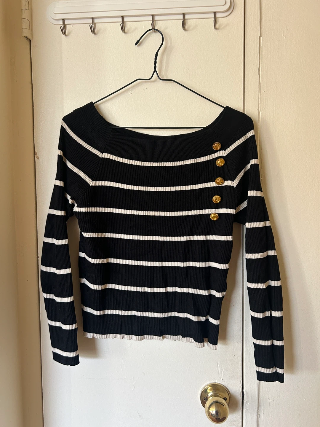 Black and white striped sweater with gold buttons