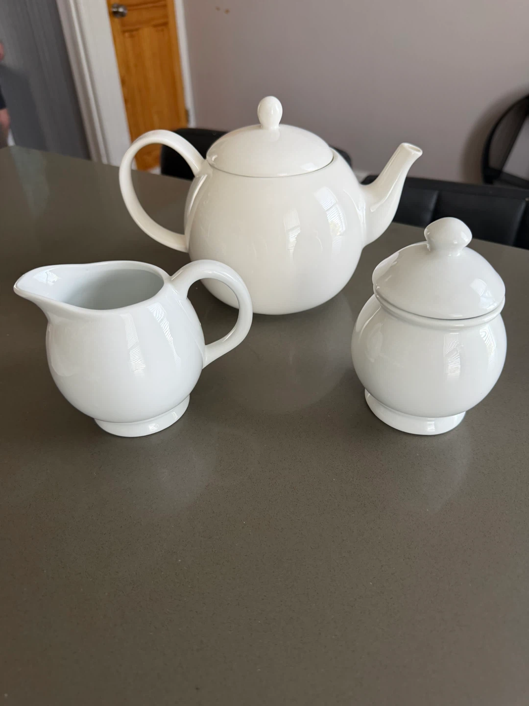 White Ceramic Teapot, Creamer, and Sugar Bowl Set