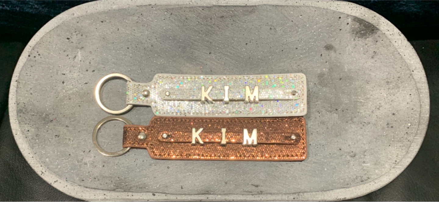 8 Dollars Each “KIM" Keychains Glitter White & Brown