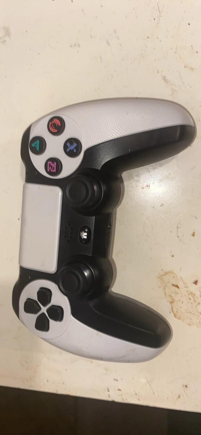 White and Black PlayStation Controller
