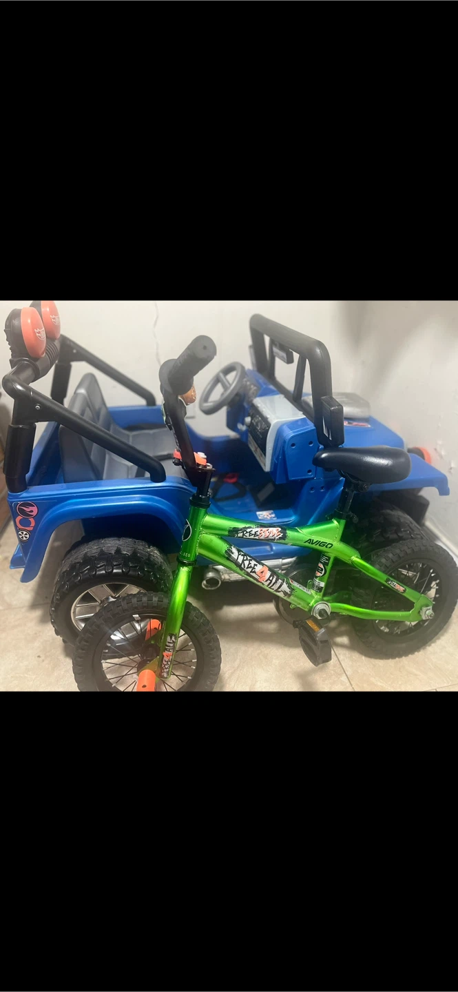 Green Freestyle BMX Bike and hot wheels toy car