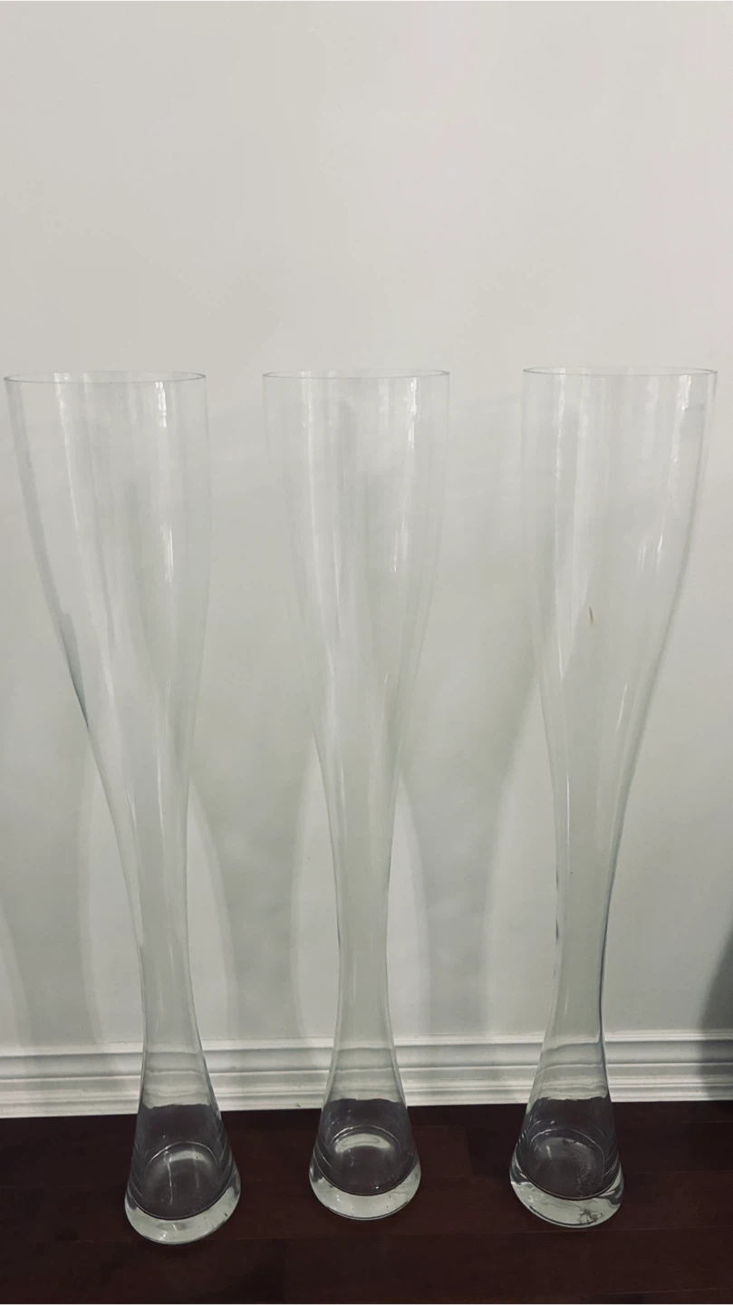 Three 40” high glass vases