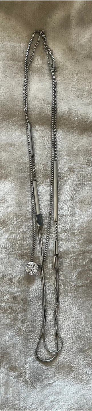 Long silver-coloured necklace