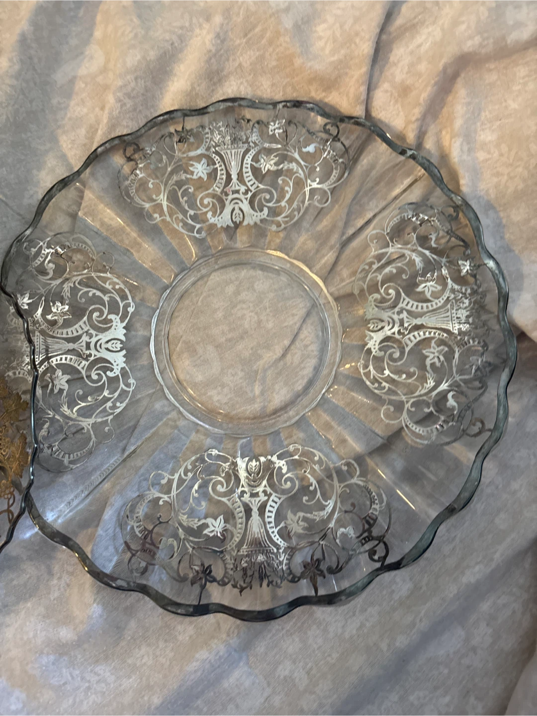 Glass serving plates with ornate silver design