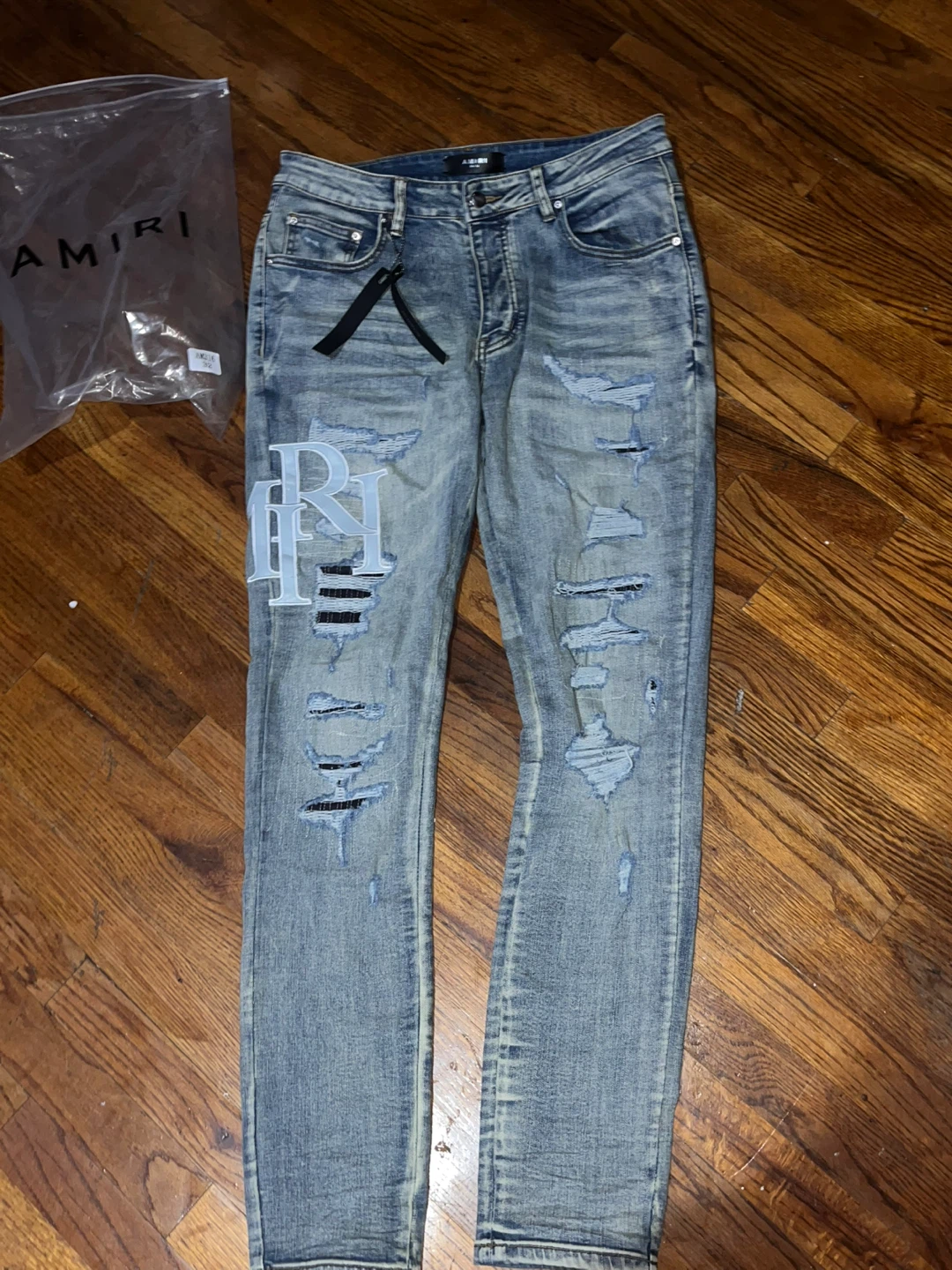 AMIRI Distressed Logo Jeans