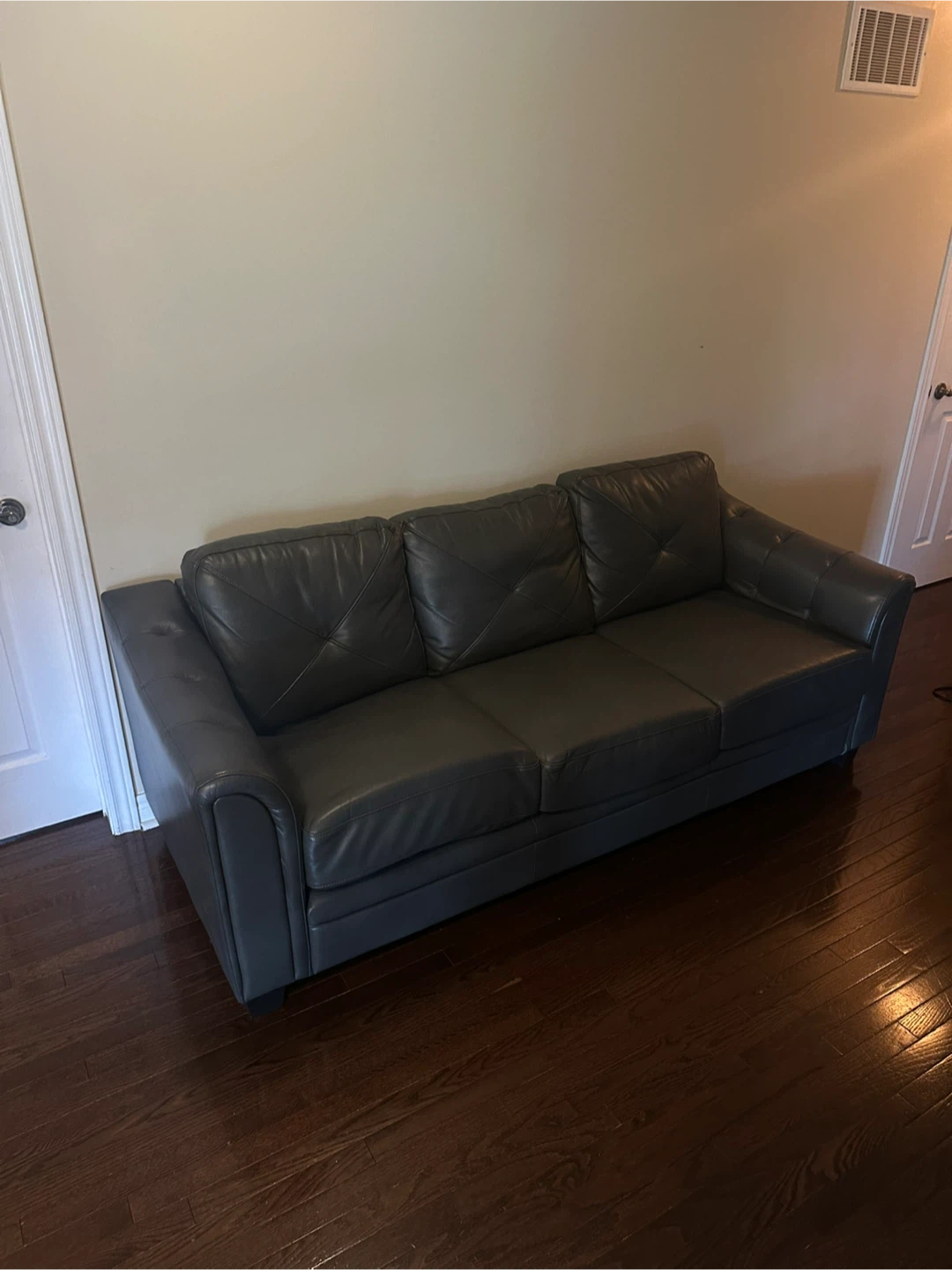 Grey Leather Sofa (slightly disheveled from the left side)