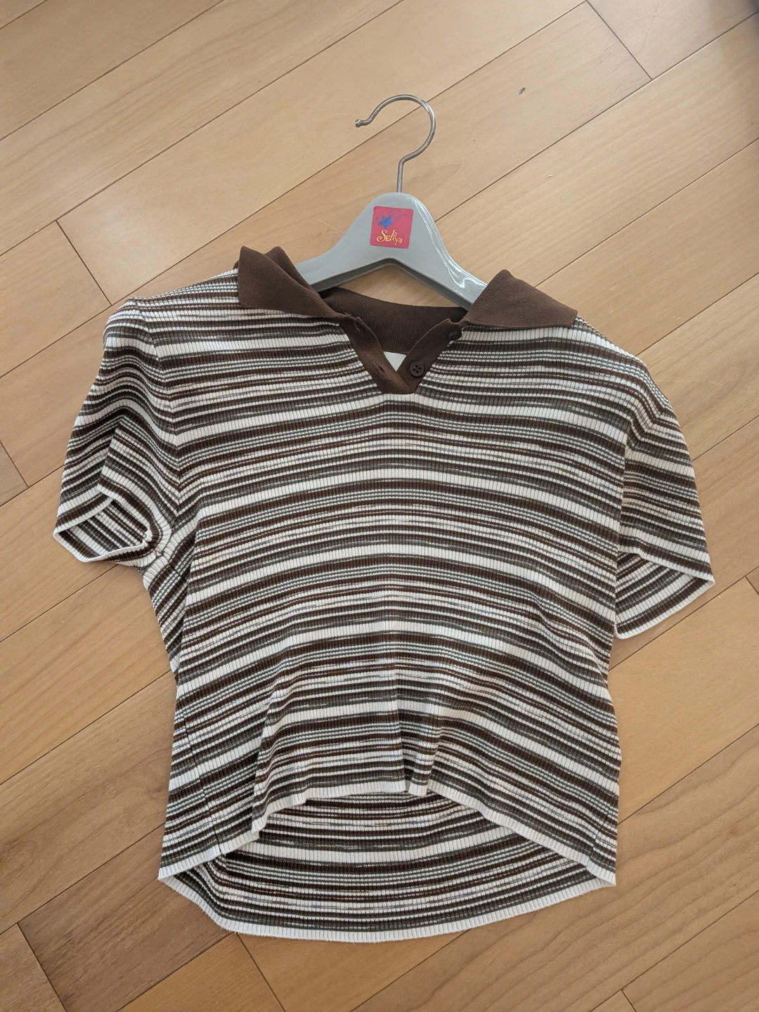 Brown and white striped polo shirt