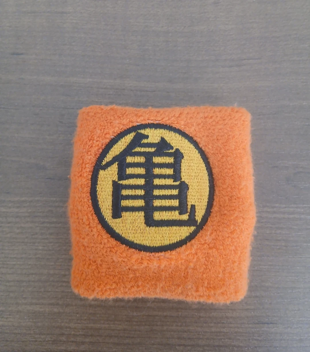 Orange Wristband with Kanji 'Kame' Symbol
