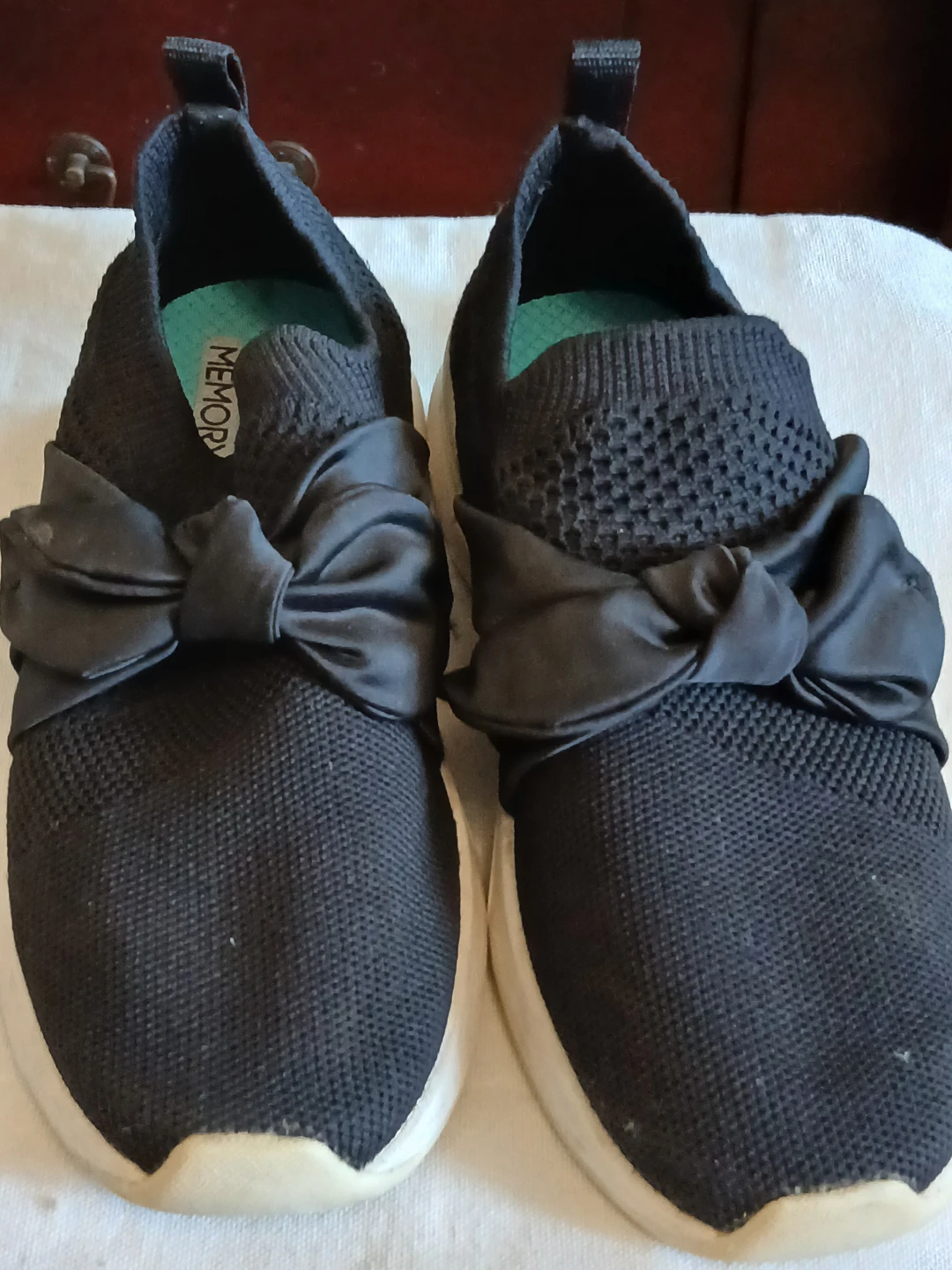 Skechers Women's Black Slip-On Sneakers with Bow
