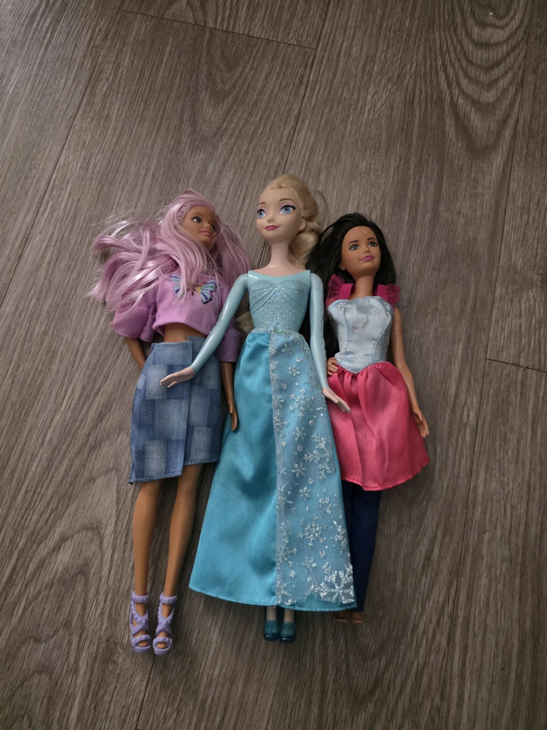 Three fashion dolls including Elsa