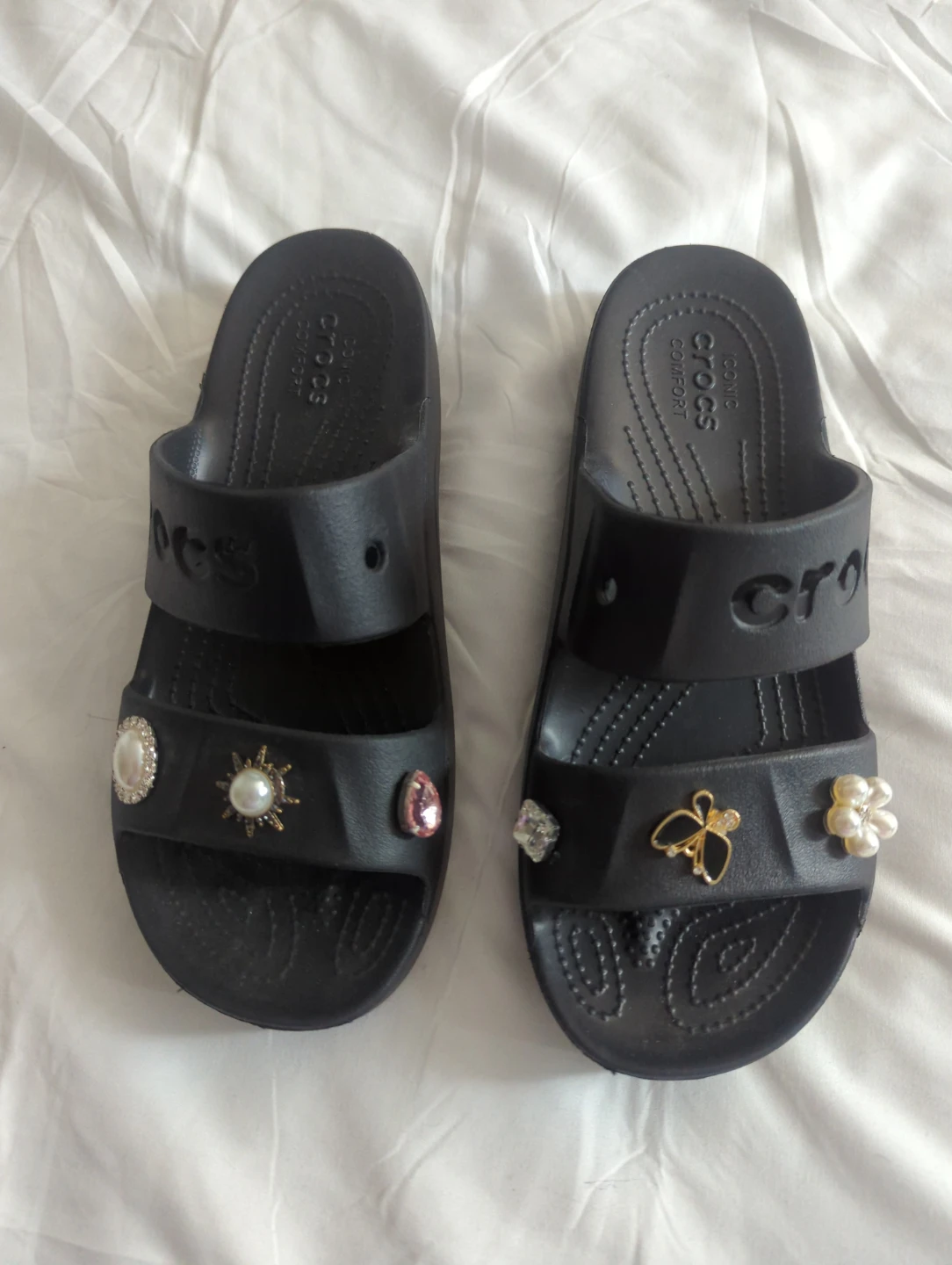 Black Crocs slides with charms