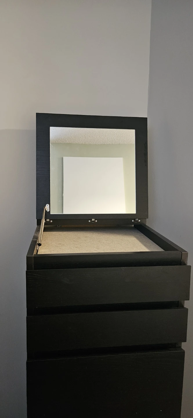 Black tall dresser with mirror