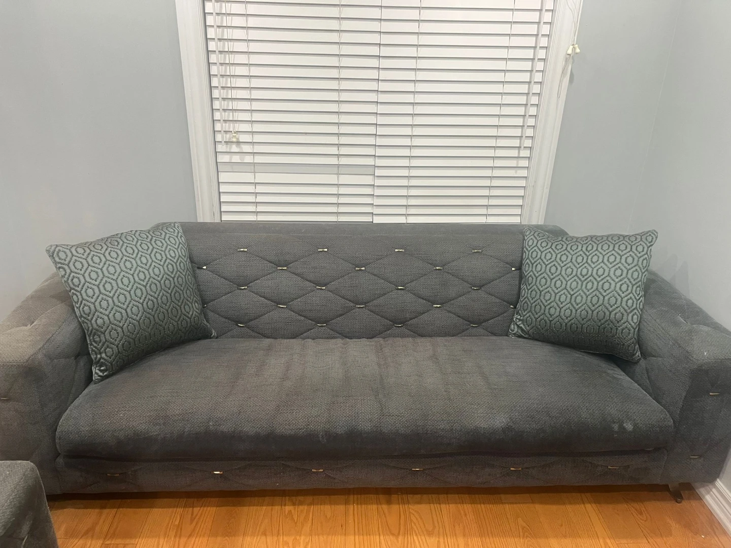 Grey Tufted Sofa with Decorative Pillows