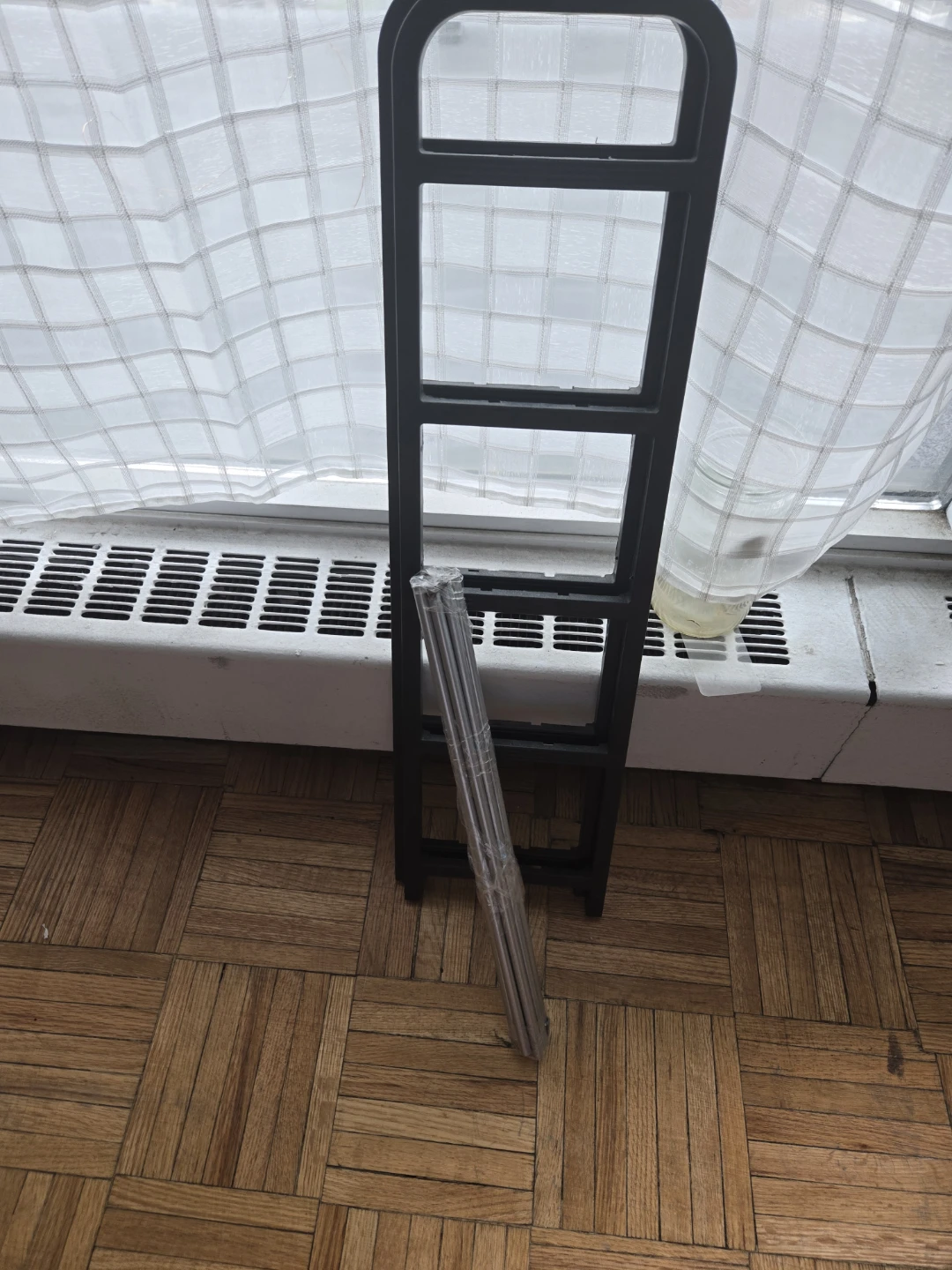 Black metal shoe rack frame
