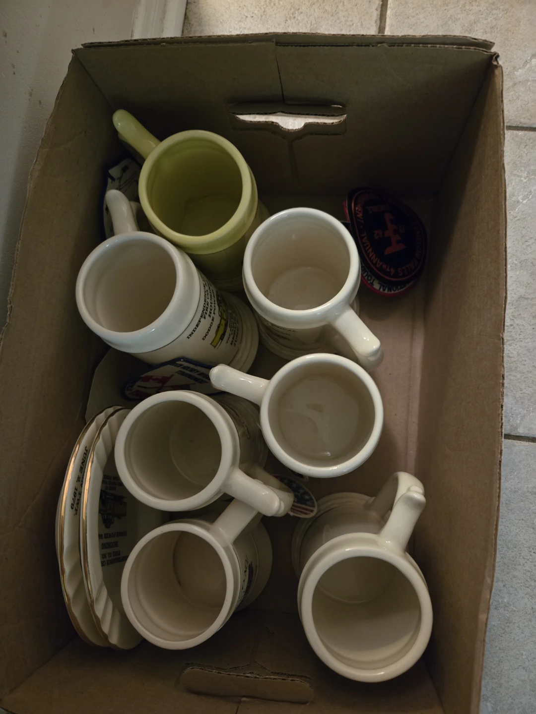 Collection of Ceramic Mugs and Plates