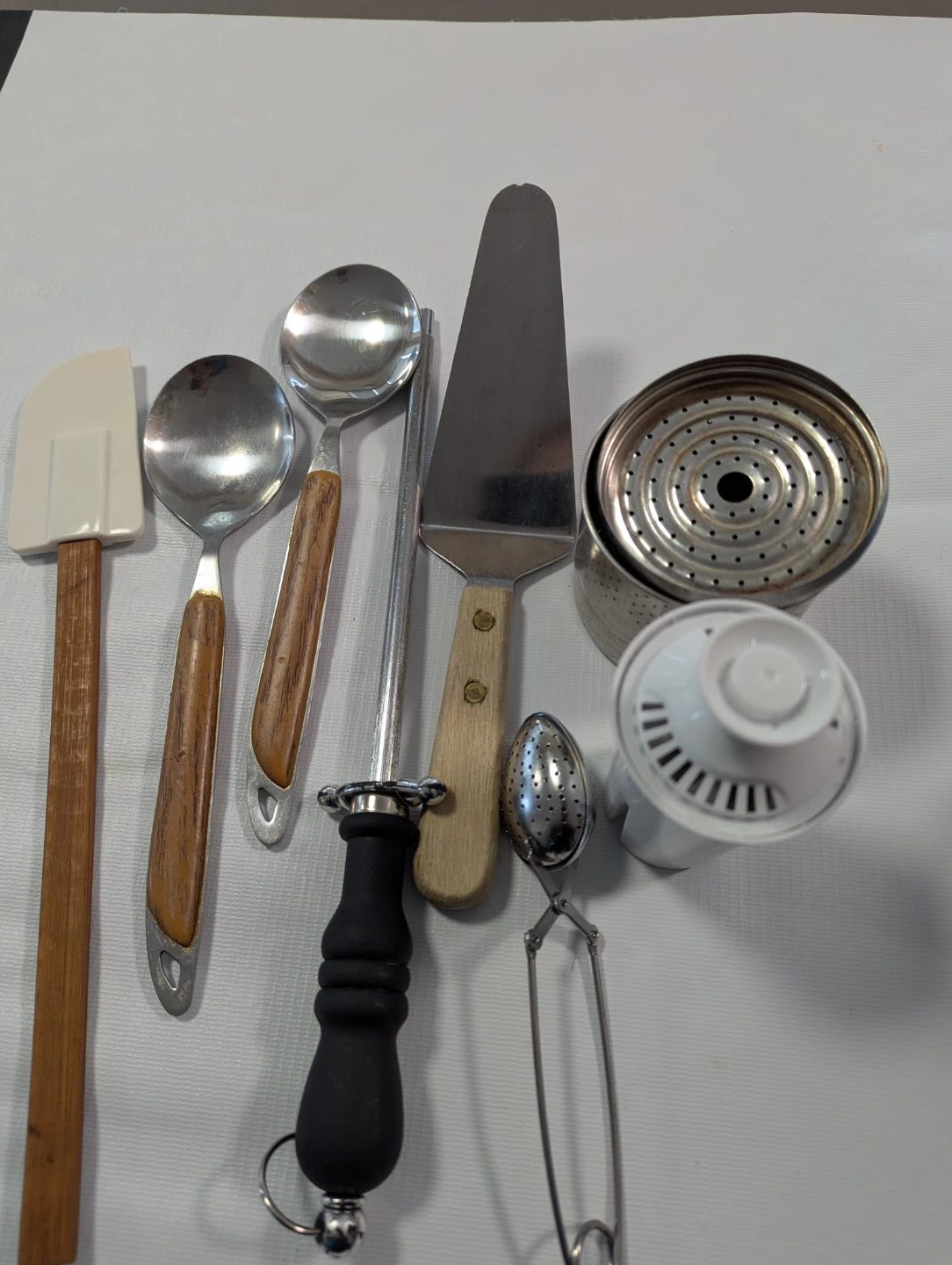 Assorted Kitchen Utensils and Coffee Pot Components