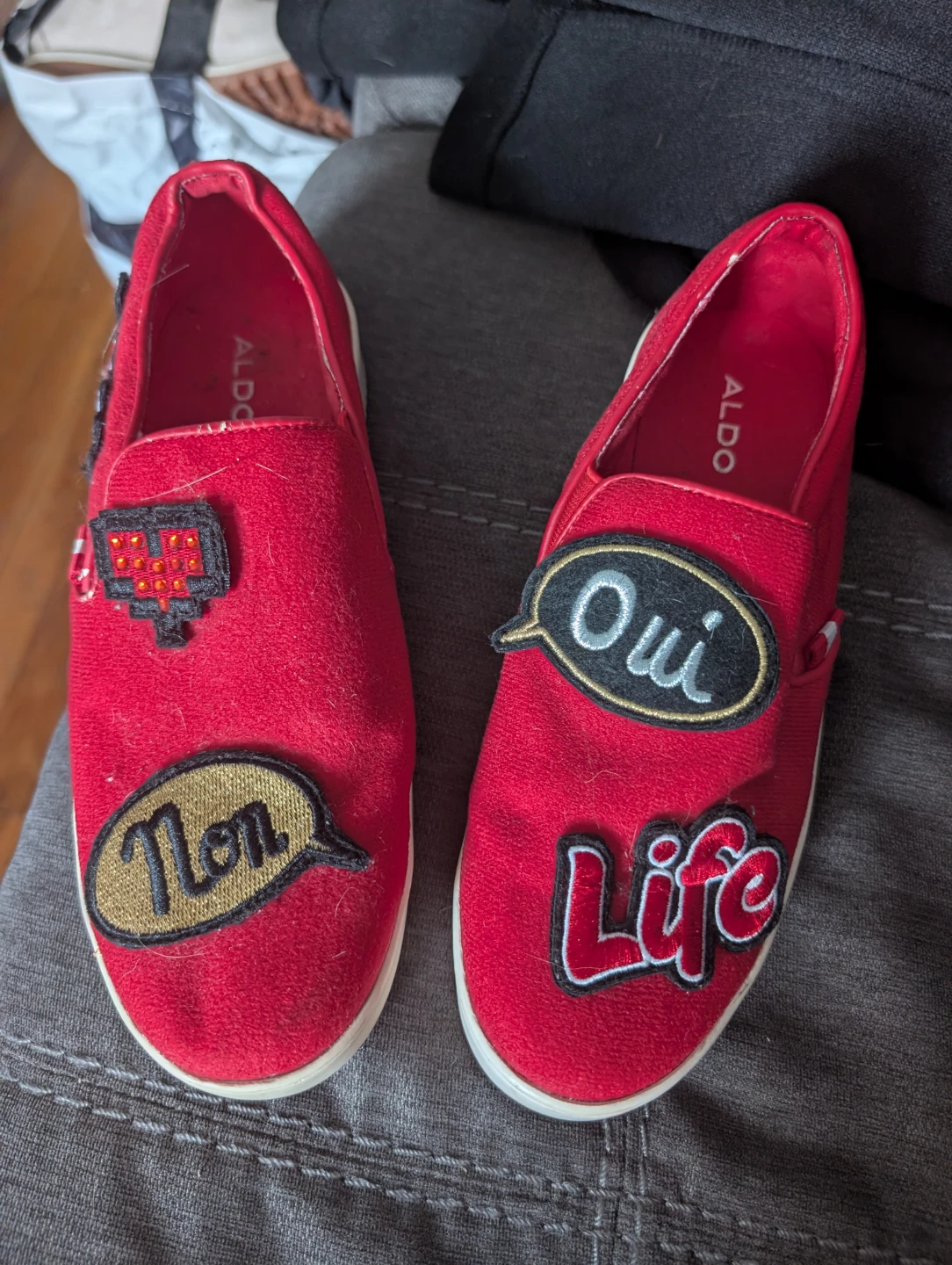 Red slip-on shoes with patches