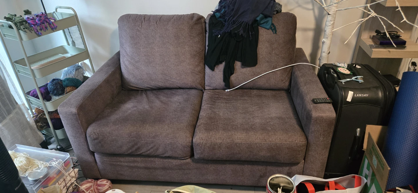 Brown upholstered loveseat