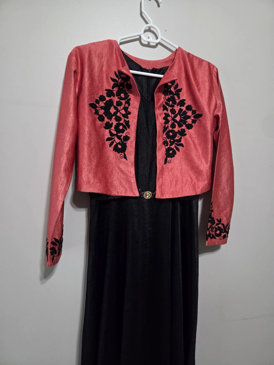 Coral embroidered jacket with black dress