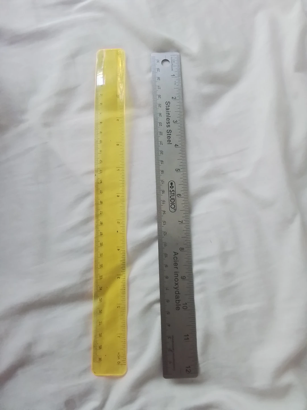 Yellow Plastic and Stainless Steel Rulers