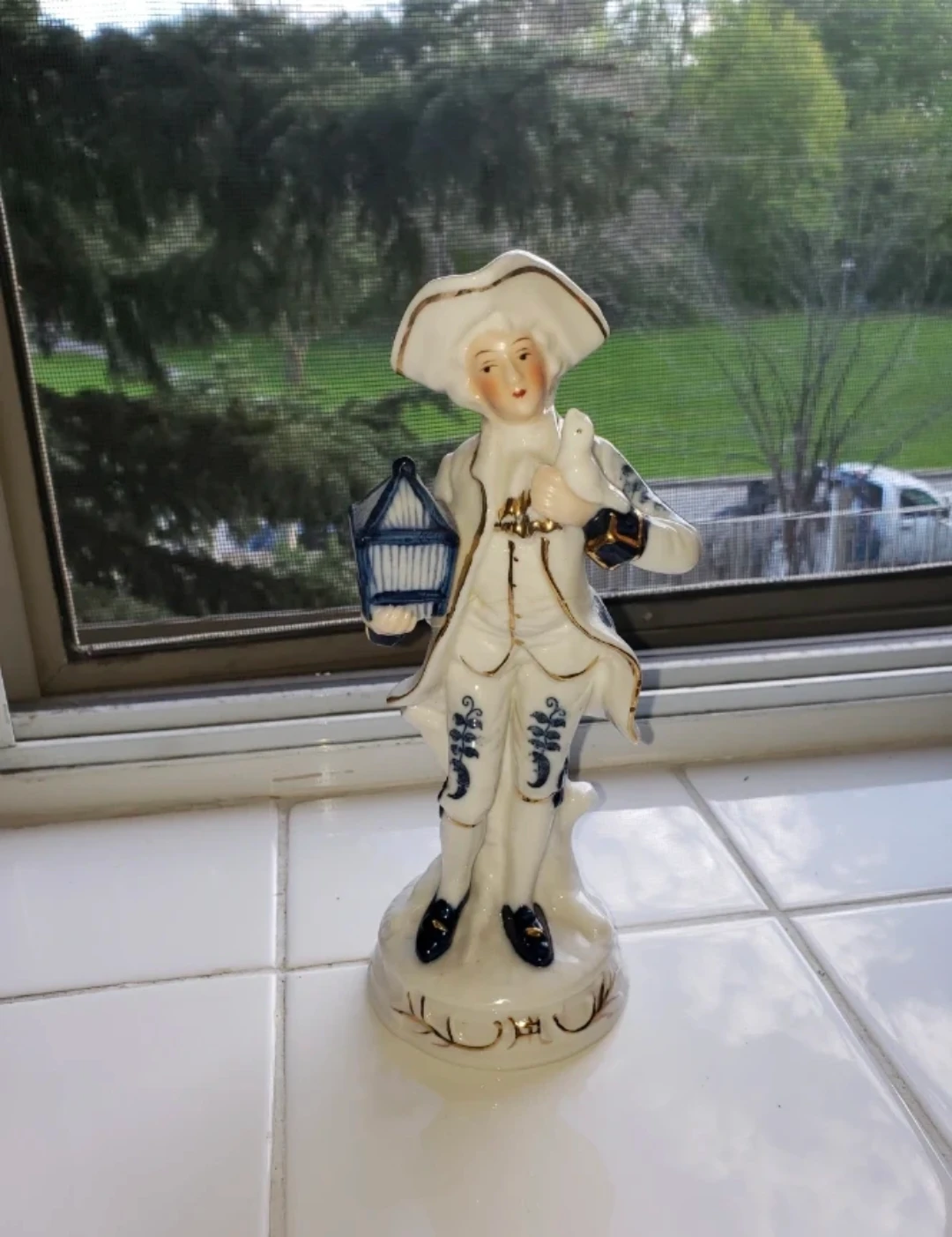 Porcelain Figurine Man with Bird Cage - photo 2