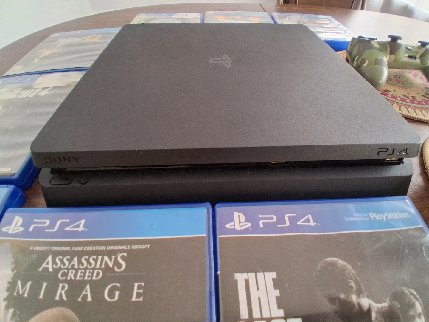 Sony PlayStation 4 Console with Games and Controllers - photo 2