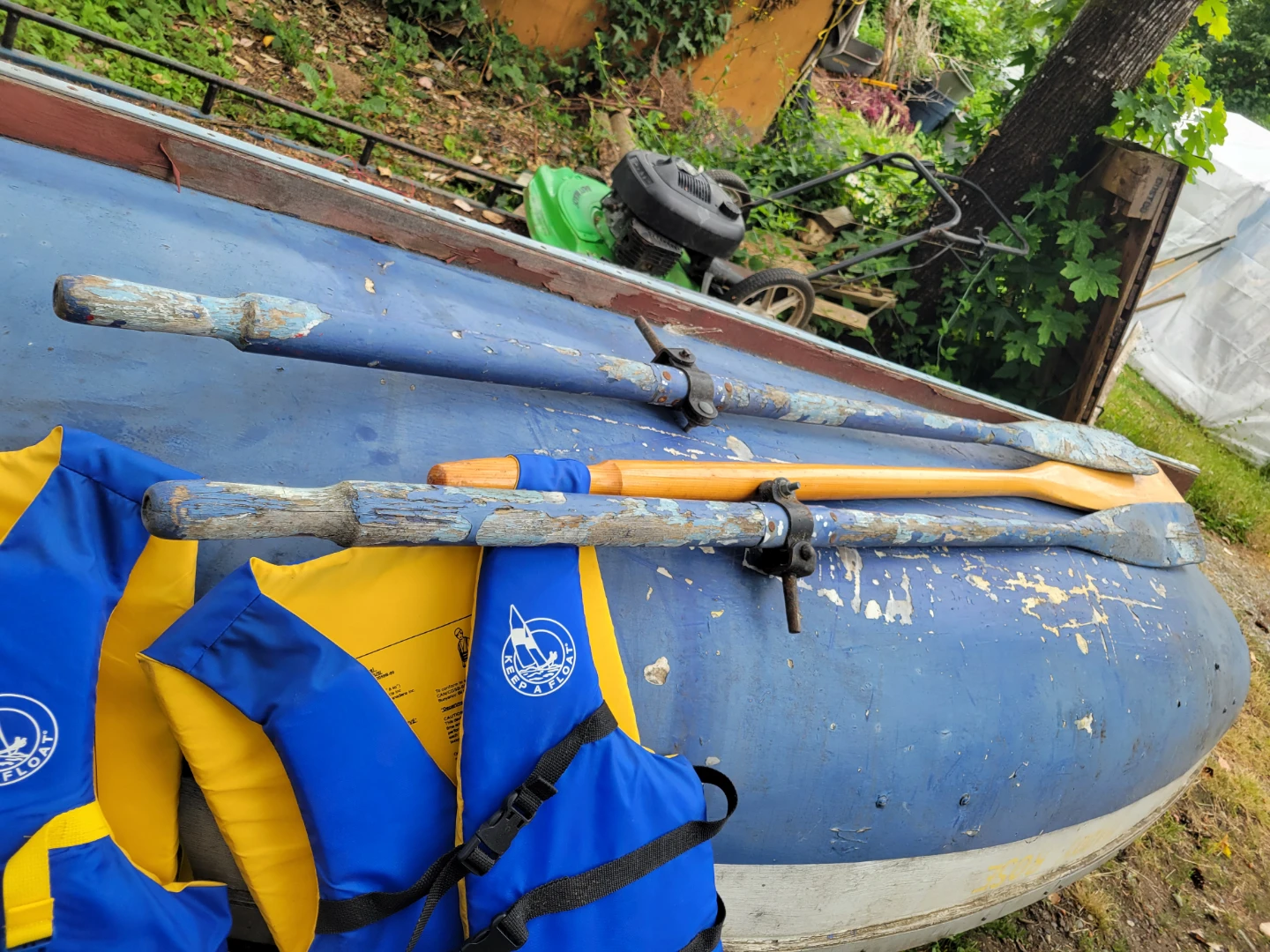 Rowboat with paddles and life jackets - photo 4