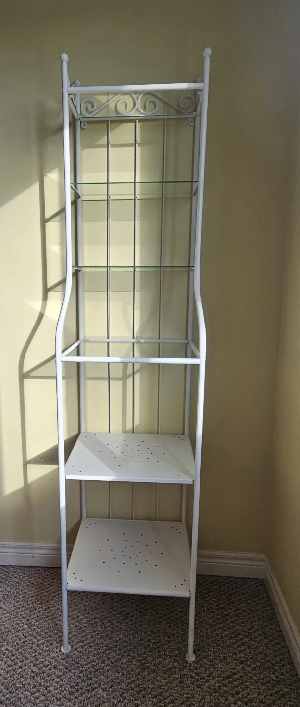 White metal baker's rack with glass shelves