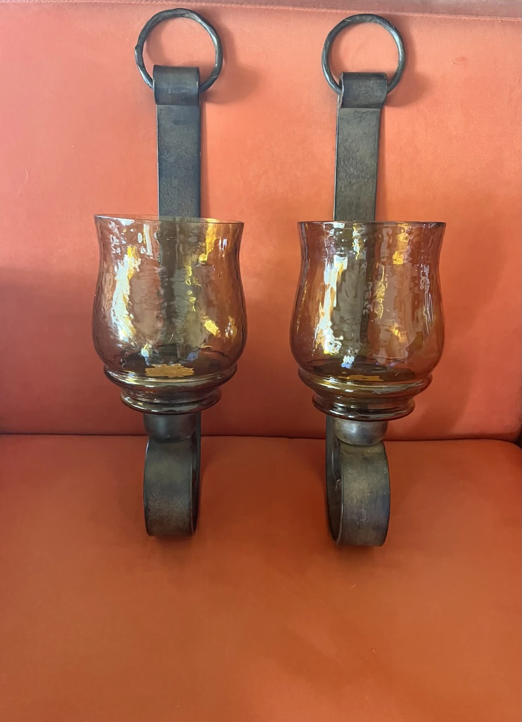 A pair of amber candle sconces