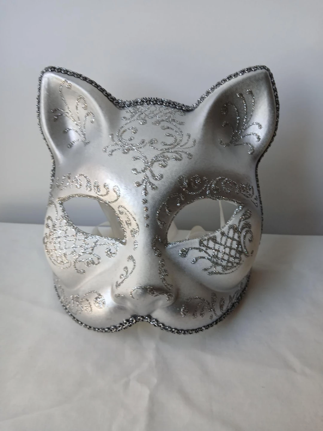 Silver Cat Mask with Glitter Embellishments. Pick up only.